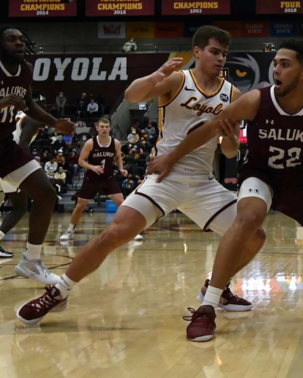 Jan 25, 2022; Chicago, Illinois, USA; Southern Illinois Salukis guard Steven Verplancken Jr. (22) dribbles against Loyola (Il) Ramblers guard Braden Norris (4) during the first half at Joseph J. Gentile Arena. Mandatory Credit: Matt Marton-USA TODAY Sports